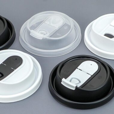 Black and transparent plastic lids for coffee cups
