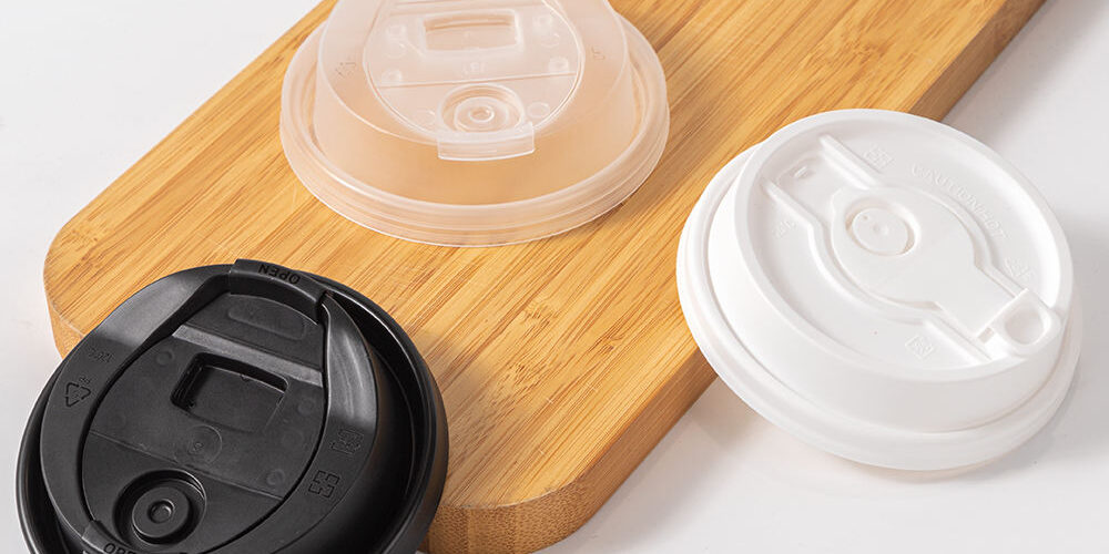 Black and transparent plastic lids for coffee cups