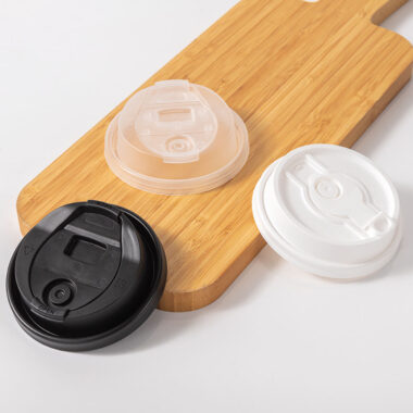 Black and transparent plastic lids for coffee cups