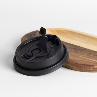 Black and transparent plastic lids for coffee cups